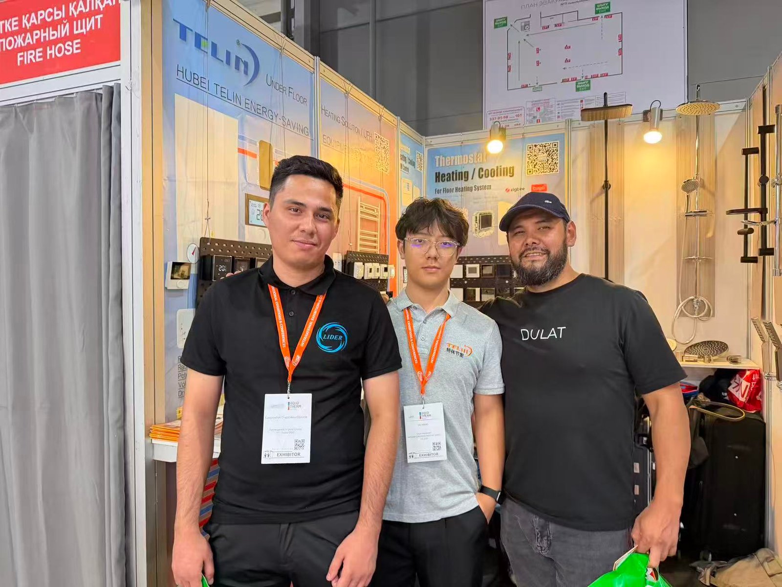 Business discussion with industry guest on exhibition floor Kazbuild 2026